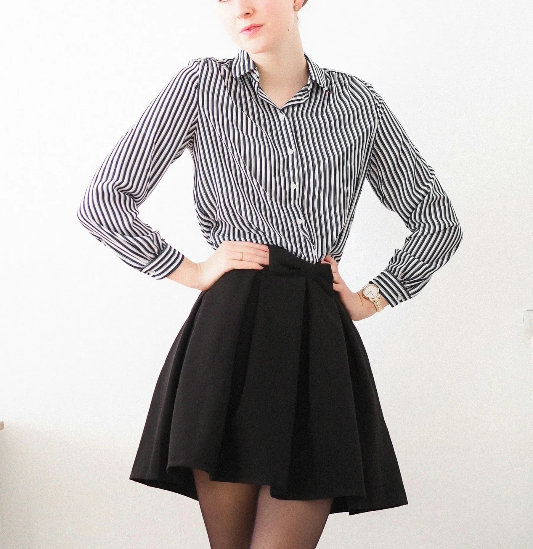 Woman in a striped shirt and black skirt