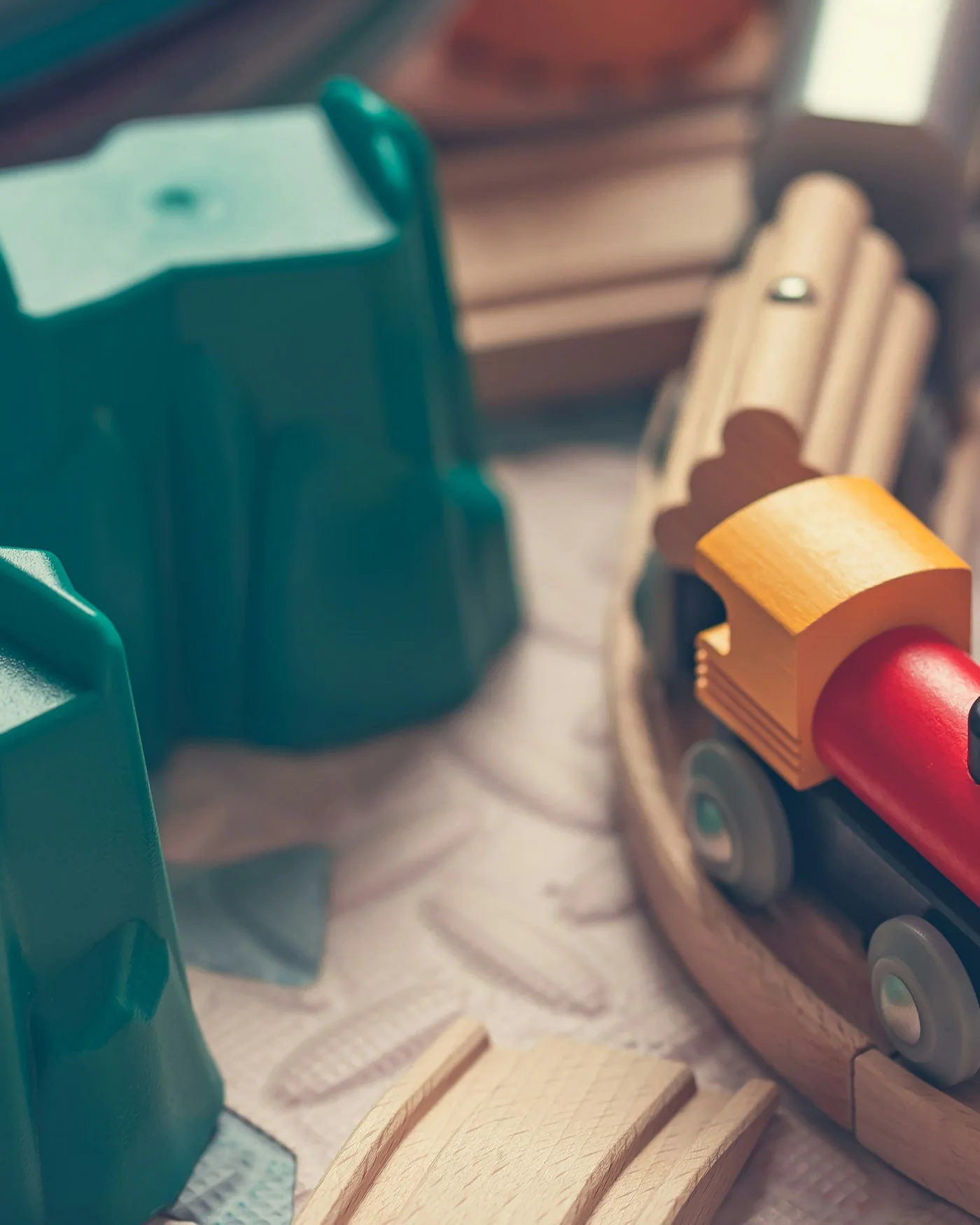 Wooden toy train on a wooden track — detail