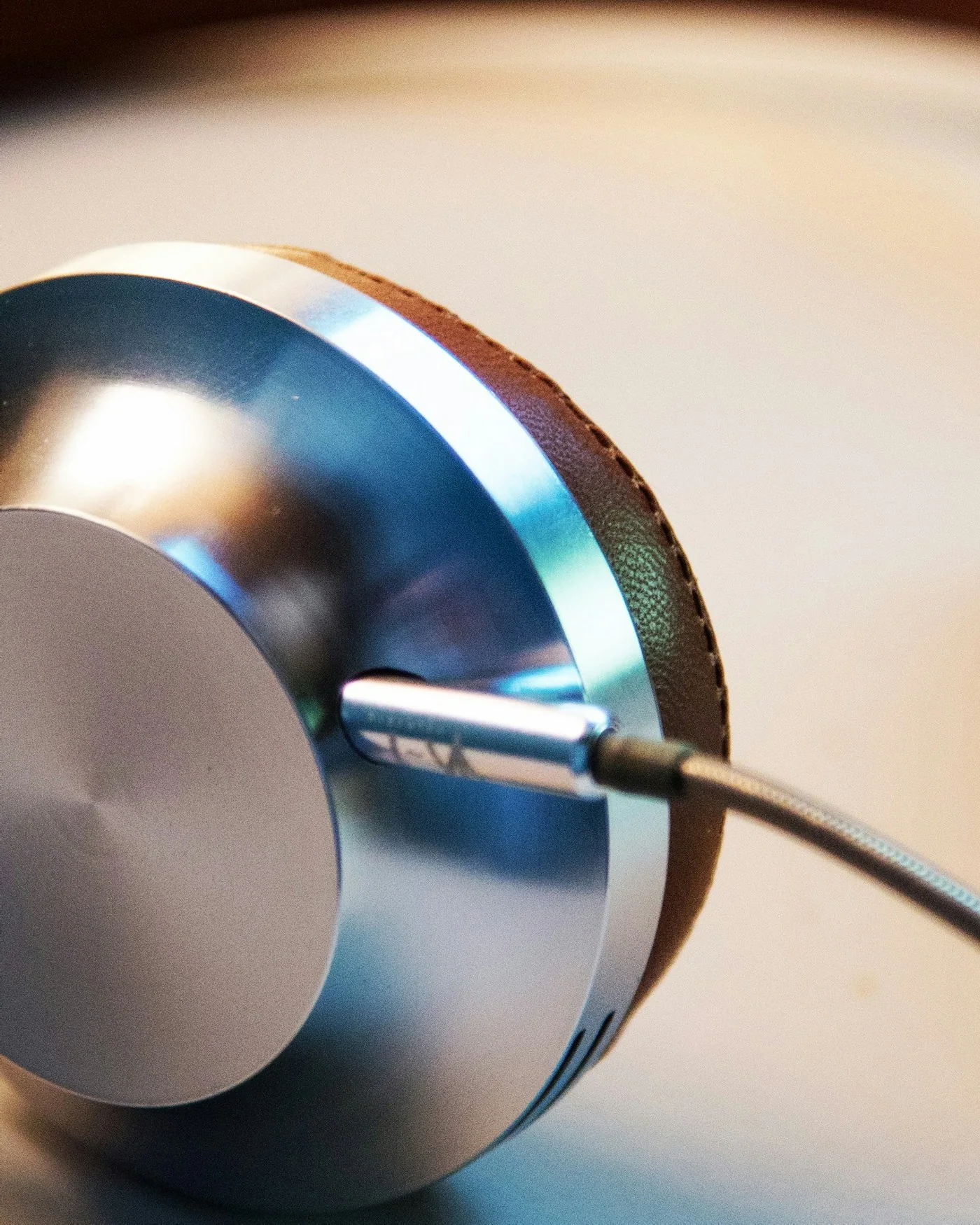Silver and brown over-ear headphones — detail