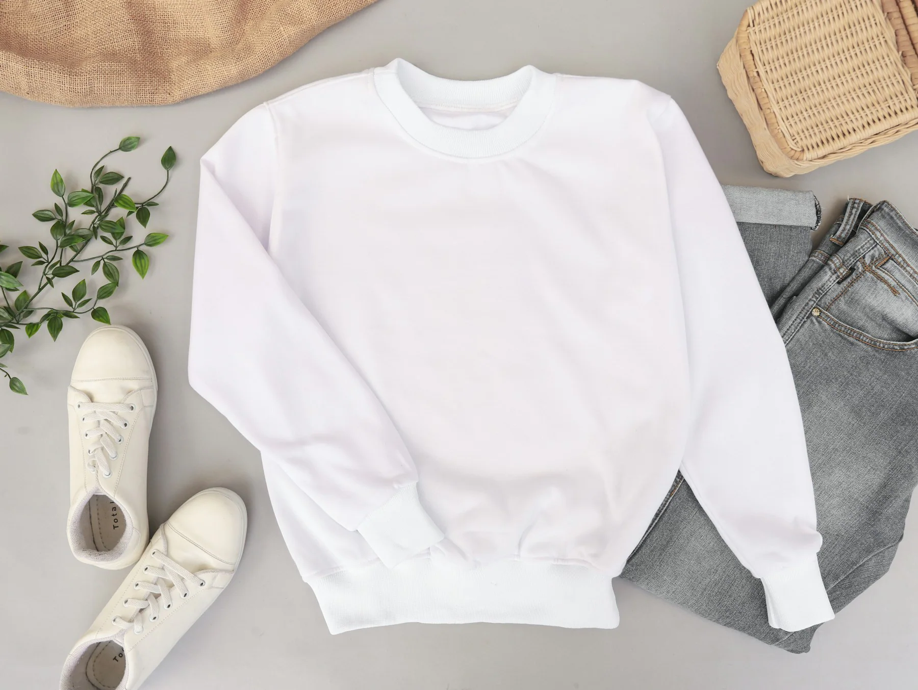 Ivory crewneck sweatshirt laid flat