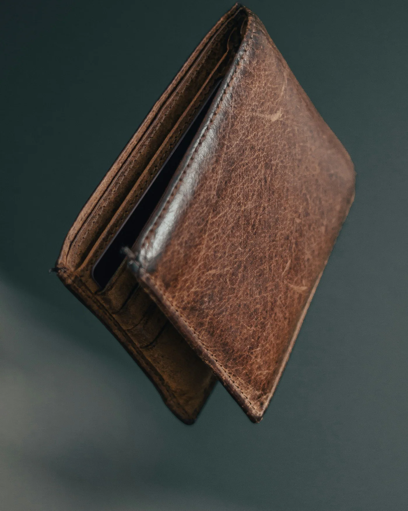 Brown leather bifold wallet — detail