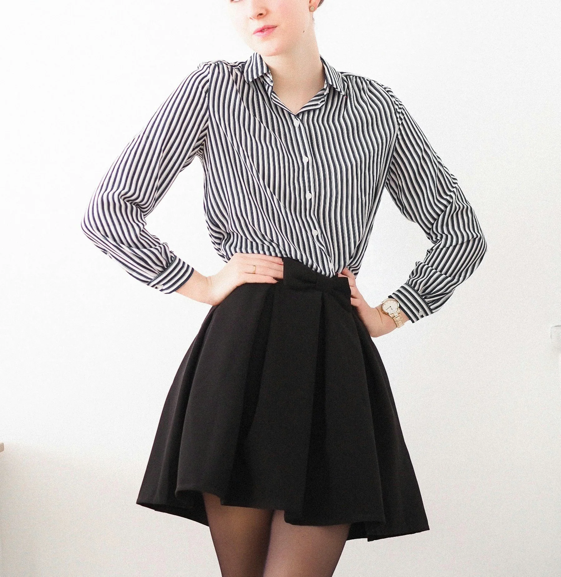 Woman in a striped shirt and black skirt
